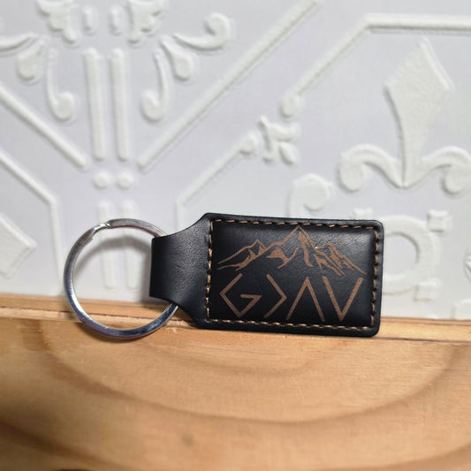 God Is Greater Than The Highs & Lows engraved leather keychain